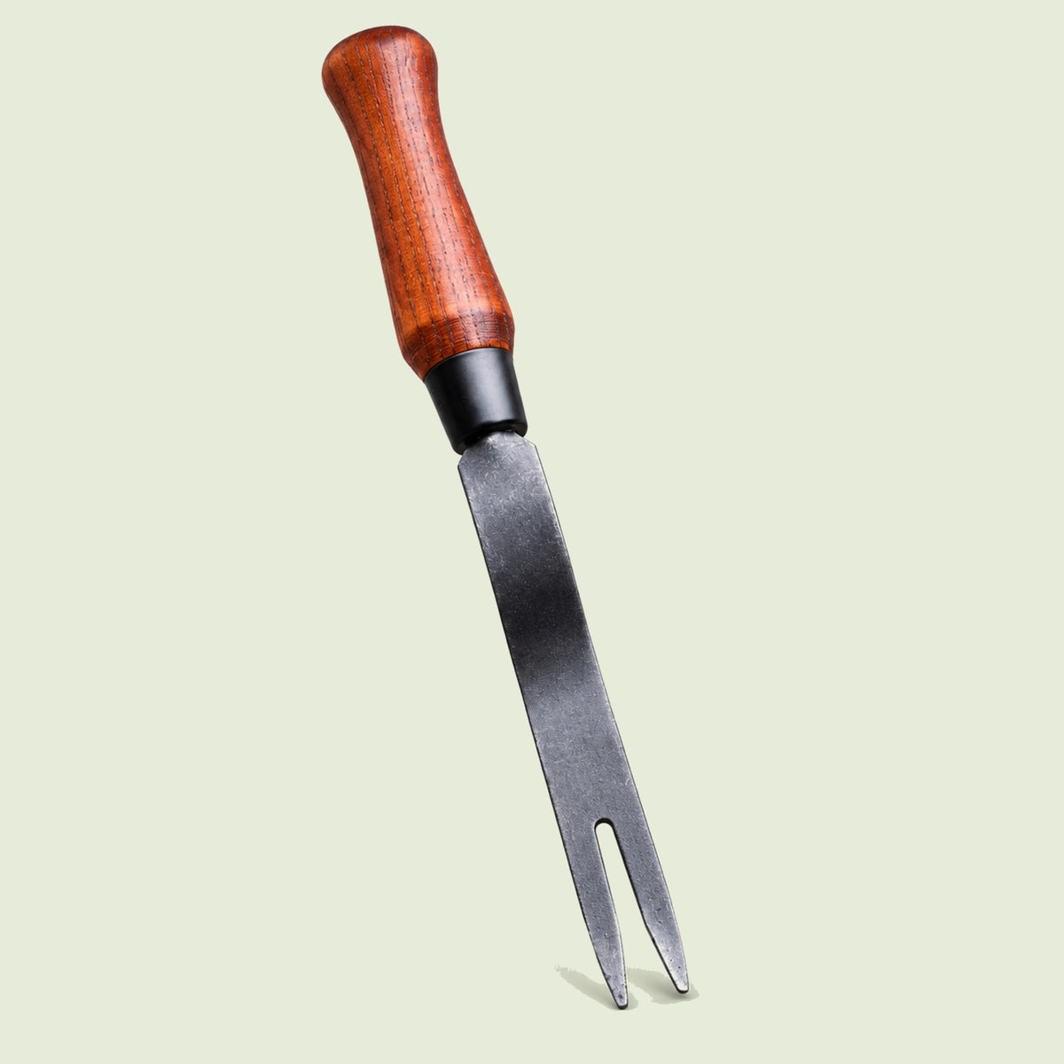 Fork-Tip Garden Weeder on a soft green background