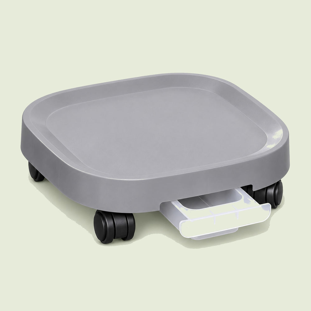 Rolling Plant Pot Base on a soft green background