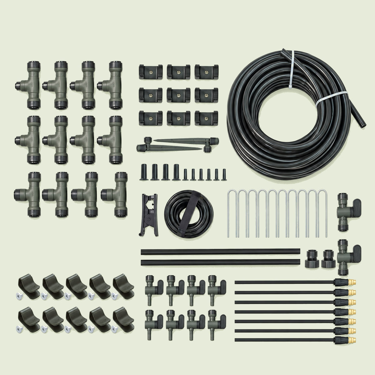 Small Irrigation Kit With Clamp Set on a soft green background