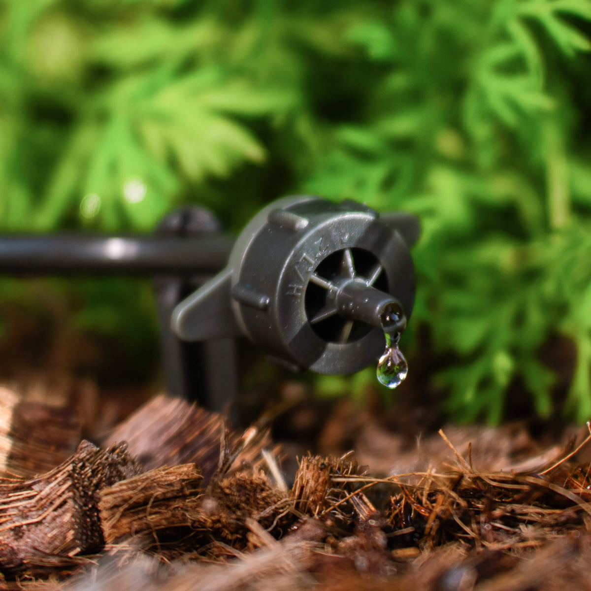 Product photo of drip nozzle and stake for irrigation