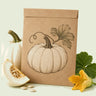 Kraft seed packet illustrated with Abominable White Pumpkin, with fresh Abominable White Pumpkin beside it