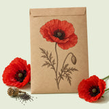 Kraft seed packet illustrated with American Legion Corn Poppy, with fresh American Legion Corn Poppy beside it