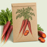 Kraft seed packet illustrated with Atomic Red Carrot, with fresh Atomic Red Carrot beside it