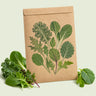 Kraft seed packet illustrated with Baby Greens Garden Mix, with fresh Baby Greens Garden Mix beside it