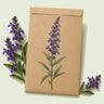 Kraft seed packet illustrated with Blue Victory Salvia, with fresh Blue Victory Salvia beside it