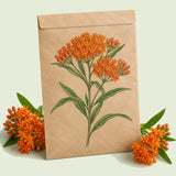 Kraft seed packet illustrated with Butterfly Milkweed, with fresh Butterfly Milkweed beside it