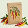 Kraft seed packet illustrated with Cayenne Blend Chile Pepper, with fresh Cayenne Blend Chile Pepper beside it