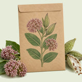 Kraft seed packet illustrated with Common Milkweed Monarch Host, with fresh Common Milkweed Monarch Host beside it
