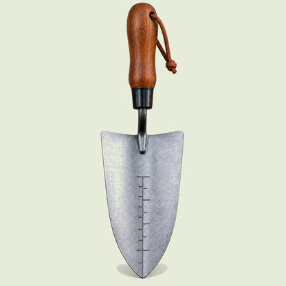 Depth-Marked Hand Trowel on a soft green background