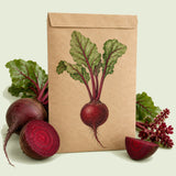 Kraft seed packet illustrated with Detroit Dark Red Beet, with fresh Detroit Dark Red Beet beside it