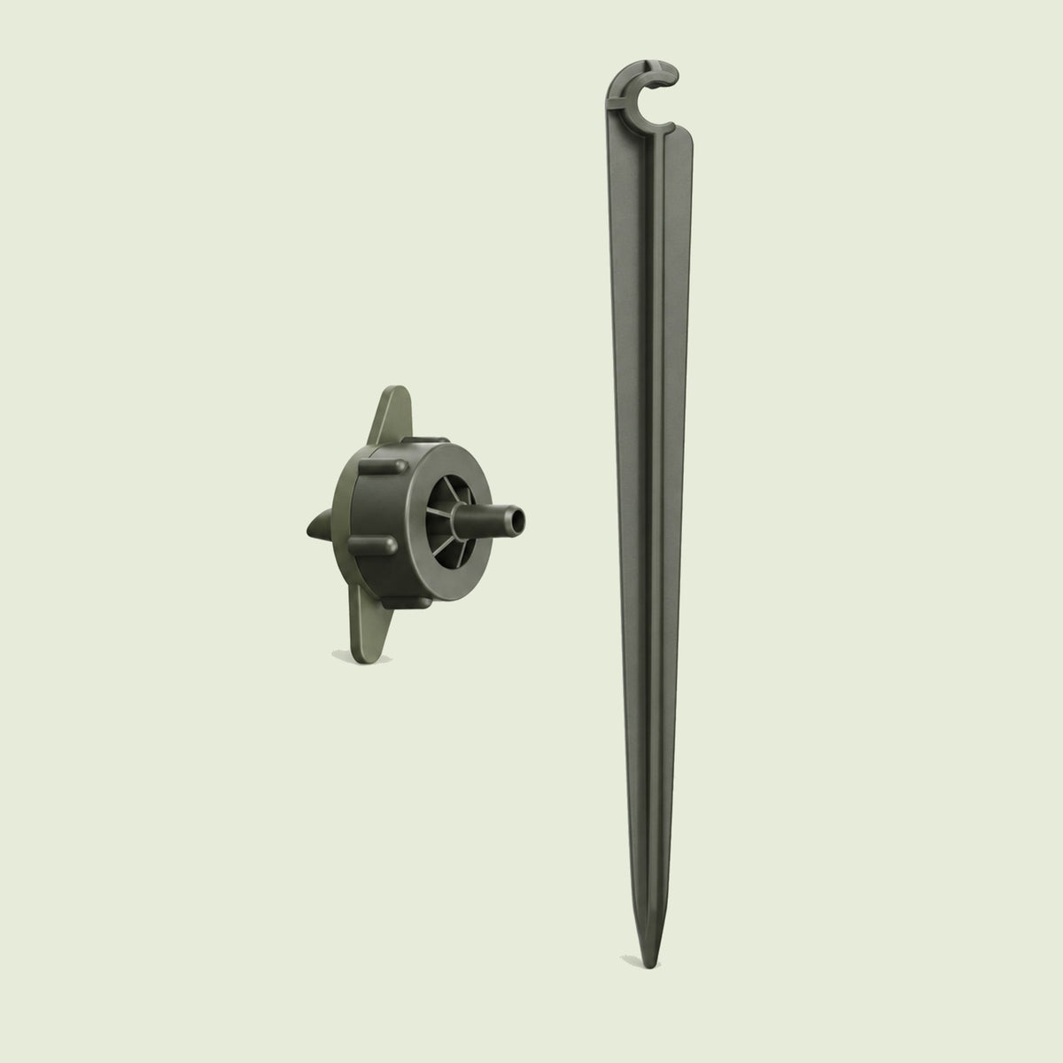 Drip Nozzle and Stake for Irrigation on a soft green background