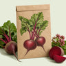 Kraft seed packet illustrated with Early Wonder Beet, with fresh Early Wonder Beet beside it