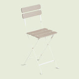 Folding Patio Stool on a soft green background