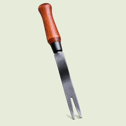 Fork-Tip Garden Weeder on a soft green background