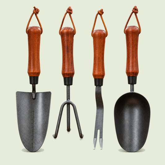 Four-Piece Garden Hand Tool Set on a soft green background