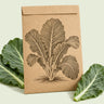 Kraft seed packet illustrated with Georgia Southern Collards, with fresh Georgia Southern Collards beside it