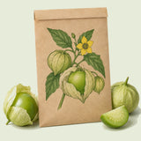 Kraft seed packet illustrated with Grande Rio Verde Tomatillo, with fresh Grande Rio Verde Tomatillo beside it