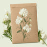 Kraft seed packet illustrated with Ice Cream Sweet Pea, with fresh Ice Cream Sweet Pea beside it