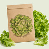 Kraft seed packet illustrated with Ice Queen Crisphead Lettuce, with fresh Ice Queen Crisphead Lettuce beside it