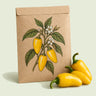 Kraft seed packet illustrated with Lemon Spice Jalapeno Pepper, with fresh Lemon Spice Jalapeno Pepper beside it
