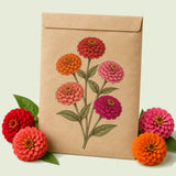 Kraft seed packet illustrated with Lilliput Double Zinnia Flower, with fresh Lilliput Double Zinnia Flower beside it