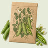 Kraft seed packet illustrated with Little Marvel Shelling Pea, with fresh Little Marvel Shelling Pea beside it