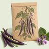 Kraft seed packet illustrated with Majesty Pole Bean, with fresh Majesty Pole Bean beside it