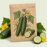 Kraft seed packet illustrated with Marketmore Slicing Cucumber, with fresh Marketmore Slicing Cucumber beside it