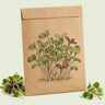 Kraft seed packet illustrated with Mild Microgreens Mix, with fresh Mild Microgreens Mix beside it