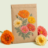 Kraft seed packet illustrated with Mission Bells California Poppy, with fresh Mission Bells California Poppy beside it