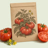 Kraft seed packet illustrated with Mountain Merit Bush Tomato, with fresh Mountain Merit Bush Tomato beside it
