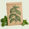 Kraft seed packet illustrated with Noga Basil, with fresh Noga Basil beside it