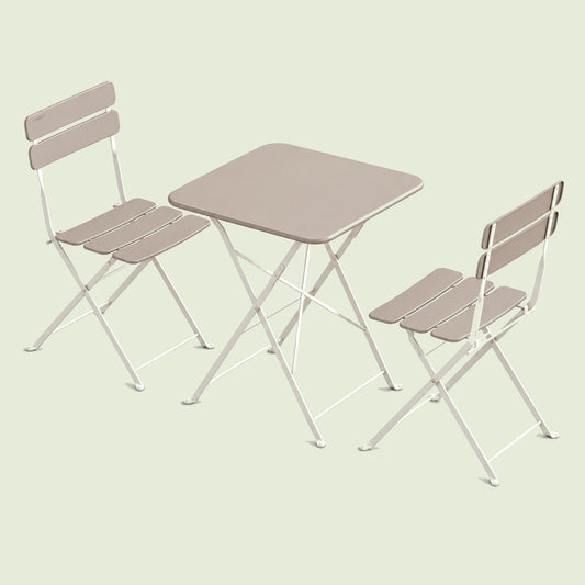 Outdoor Bistro Table and Chairs on a soft green background