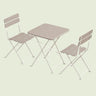 Outdoor Bistro Table and Chairs on a soft green background