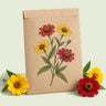 Kraft seed packet illustrated with Peruvian Zinnia Blend, with fresh Peruvian Zinnia Blend beside it