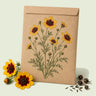Kraft seed packet illustrated with Plains Coreopsis, with fresh Plains Coreopsis beside it