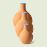 Porous Clay Watering Pot on a soft green background