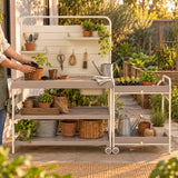 Potting Bench and Cart Set in use in a home garden
