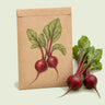 Kraft seed packet illustrated with Robin Baby Beet, with fresh Robin Baby Beet beside it