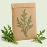 Kraft seed packet illustrated with Rocky Wild Arugula, with fresh Rocky Wild Arugula beside it