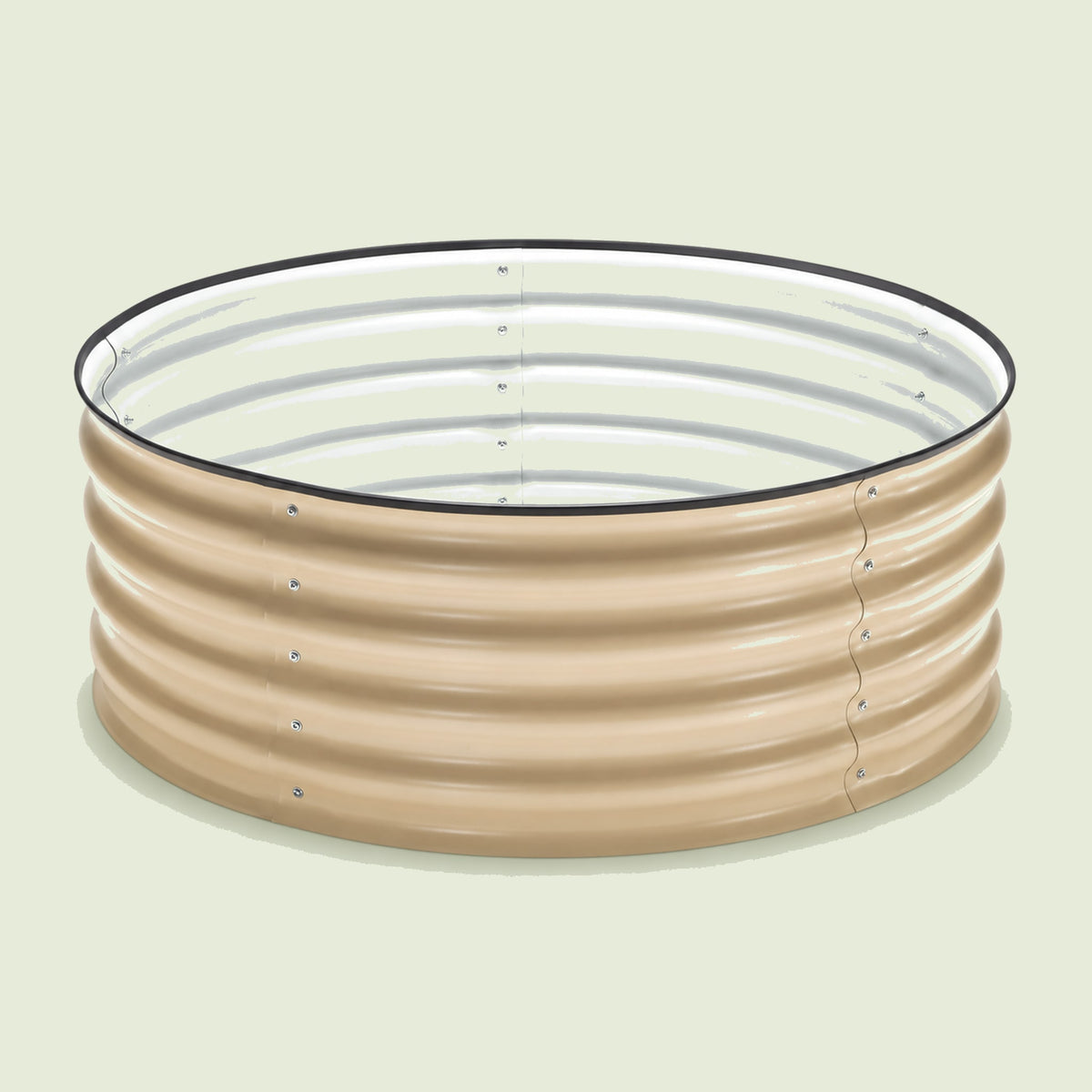 Round Metal Raised Garden Bed, 15 Inches Tall on a soft green background