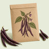 Kraft seed packet illustrated with Royal Burgundy Bush Bean, with fresh Royal Burgundy Bush Bean beside it