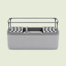 Self-Watering Herb Planter With Trellis on a soft green background