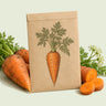 Kraft seed packet illustrated with Shin Kuroda Carrot, with fresh Shin Kuroda Carrot beside it