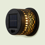 Solar Mandala Wall Light on a soft green background