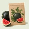 Kraft seed packet illustrated with Sugar Baby Watermelon, with fresh Sugar Baby Watermelon beside it