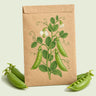 Kraft seed packet illustrated with Sugar Snap Pea, with fresh Sugar Snap Pea beside it