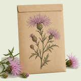 Kraft seed packet illustrated with Sweet Sultan, with fresh Sweet Sultan beside it