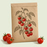 Kraft seed packet illustrated with Sweetie Cherry Tomato, with fresh Sweetie Cherry Tomato beside it