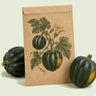 Kraft seed packet illustrated with Table King Acorn Squash, with fresh Table King Acorn Squash beside it